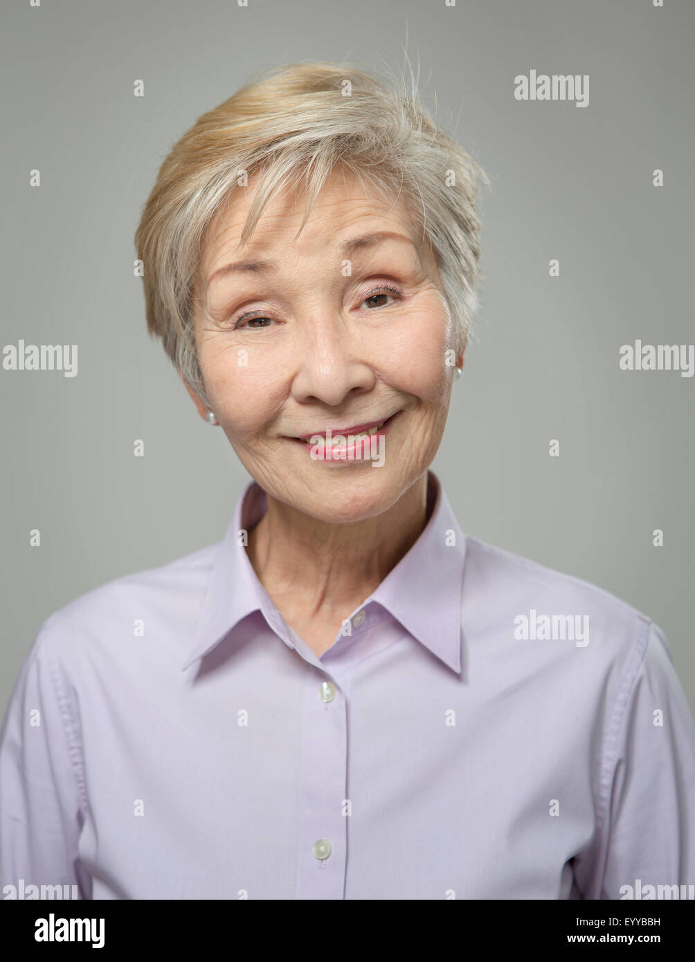 Close up of older Japanese woman smiling Stock Photo