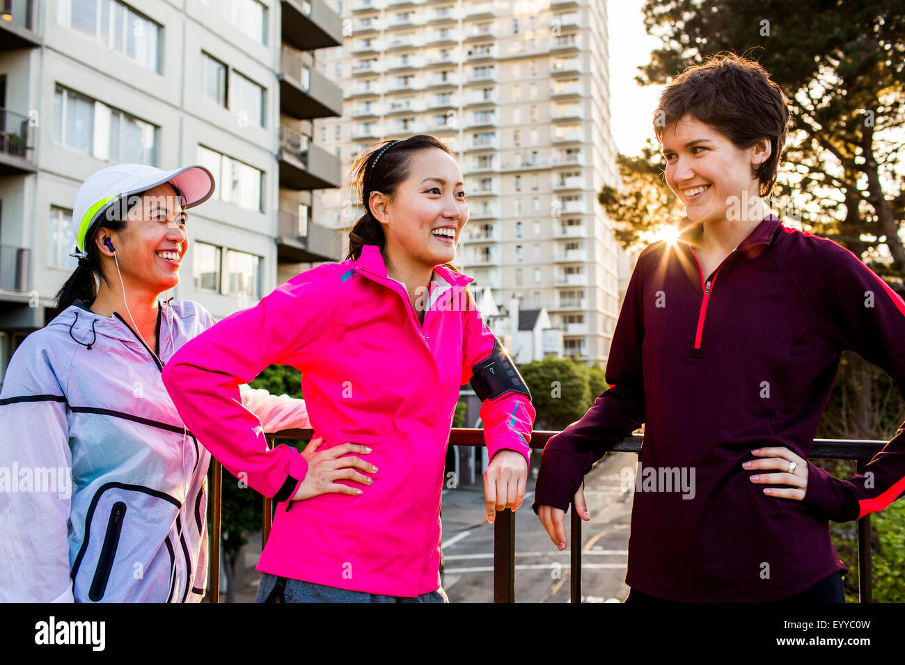 Runners talking in city Stock Photo