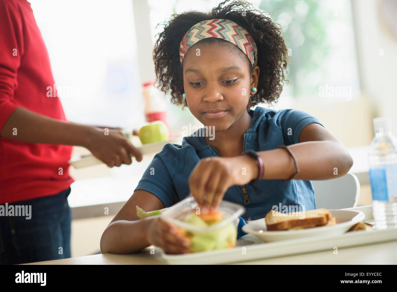 Black students eating lunch in school cafeteria Stock Photo