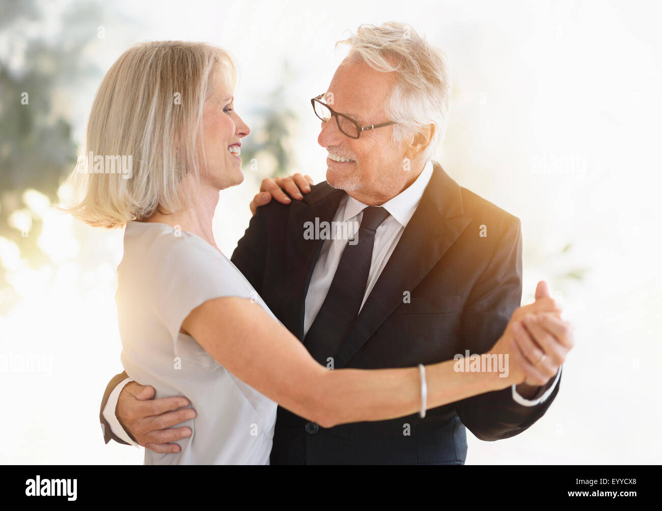 happy old couple dancing in the night life