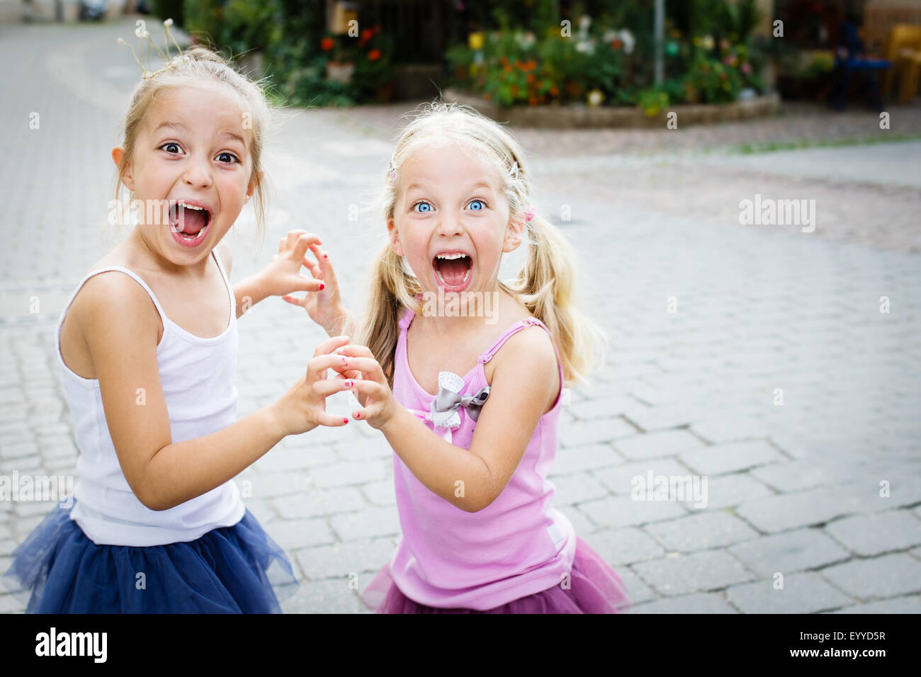 Two little sisters shouting. Selective focus. Stock Photo