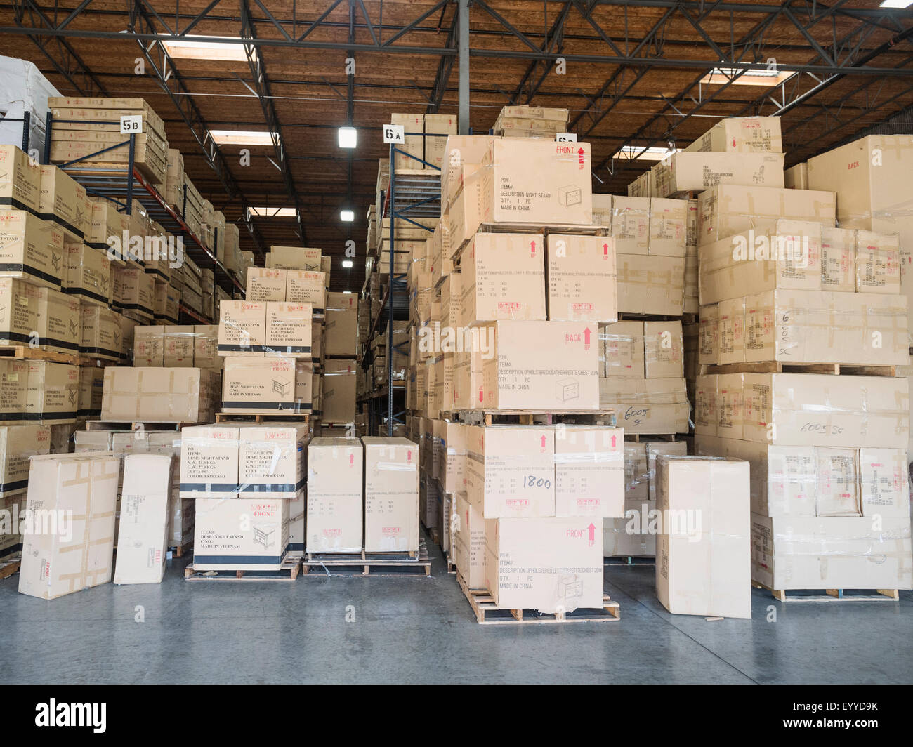 Cardboard boxes in warehouse Stock Photo - Alamy