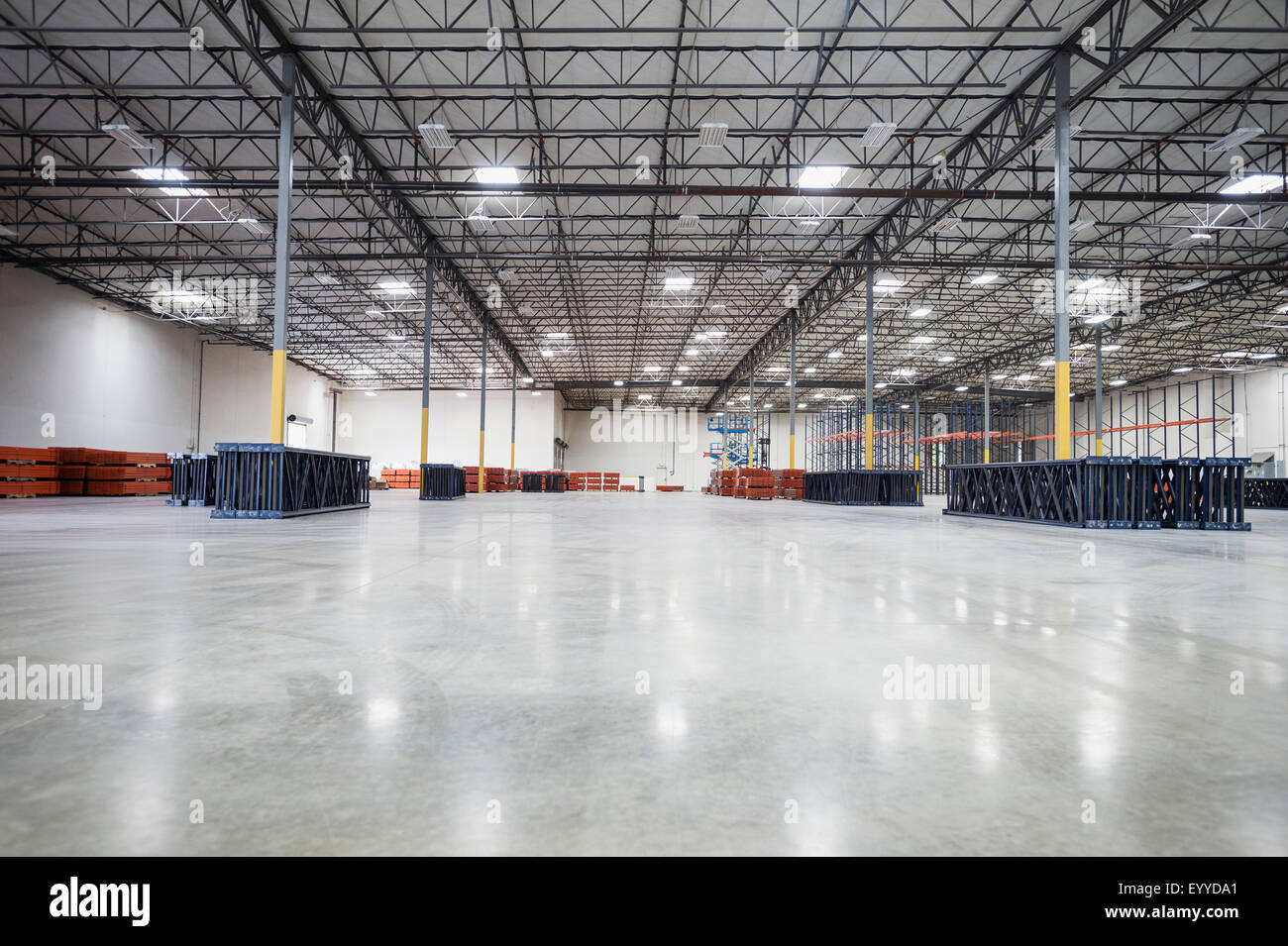 Infrastructure and lighting in empty warehouse Stock Photo