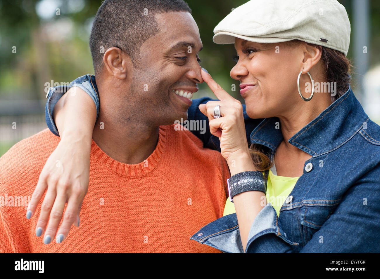 Close up of couple playing outdoors Stock Photo