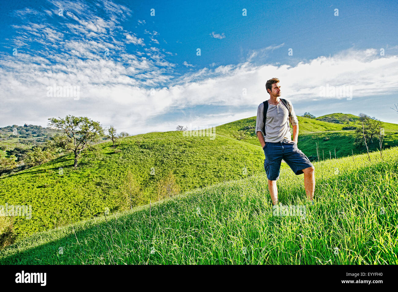 Man standing on a hill hi-res stock photography and images - Alamy