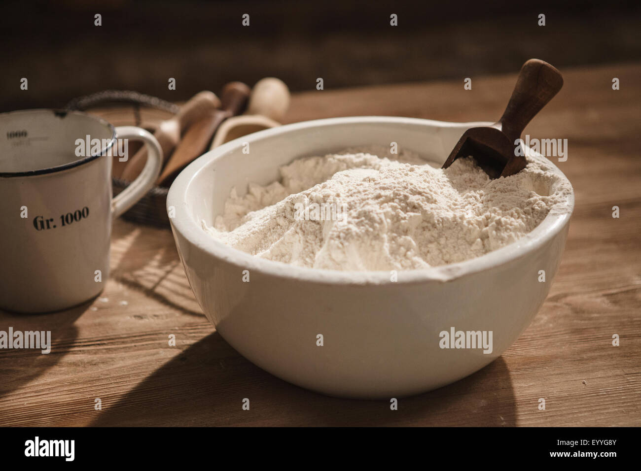Close up of bowl of flour with scoop Stock Photo