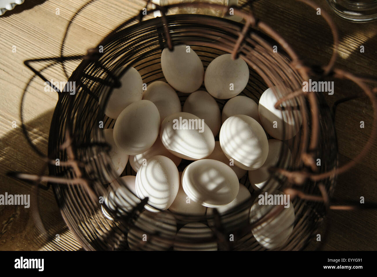 Close up of wire basket of eggs Stock Photo