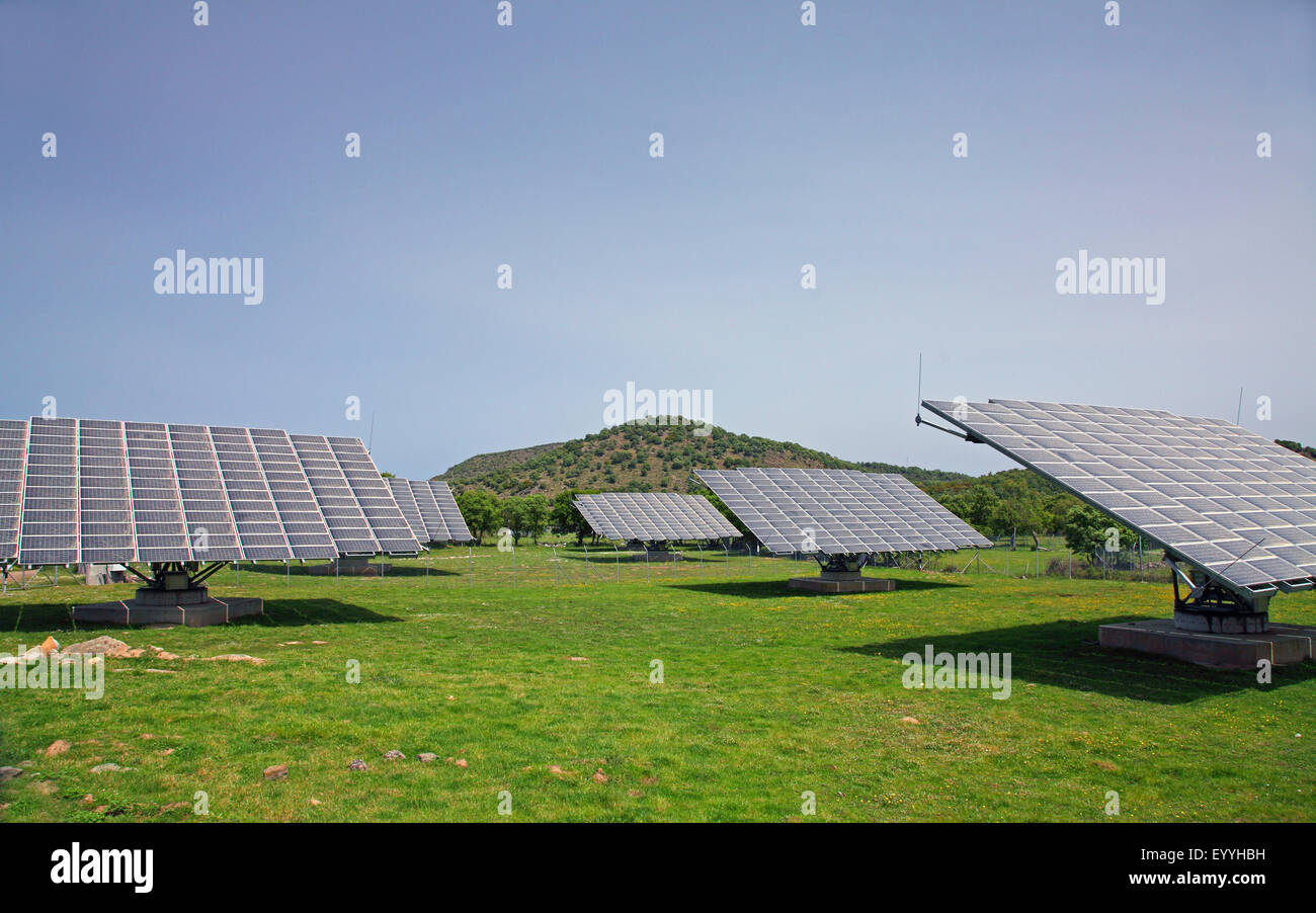 solar collectors stand on grassland near Skalochori, Greece, Lesbos Stock Photo