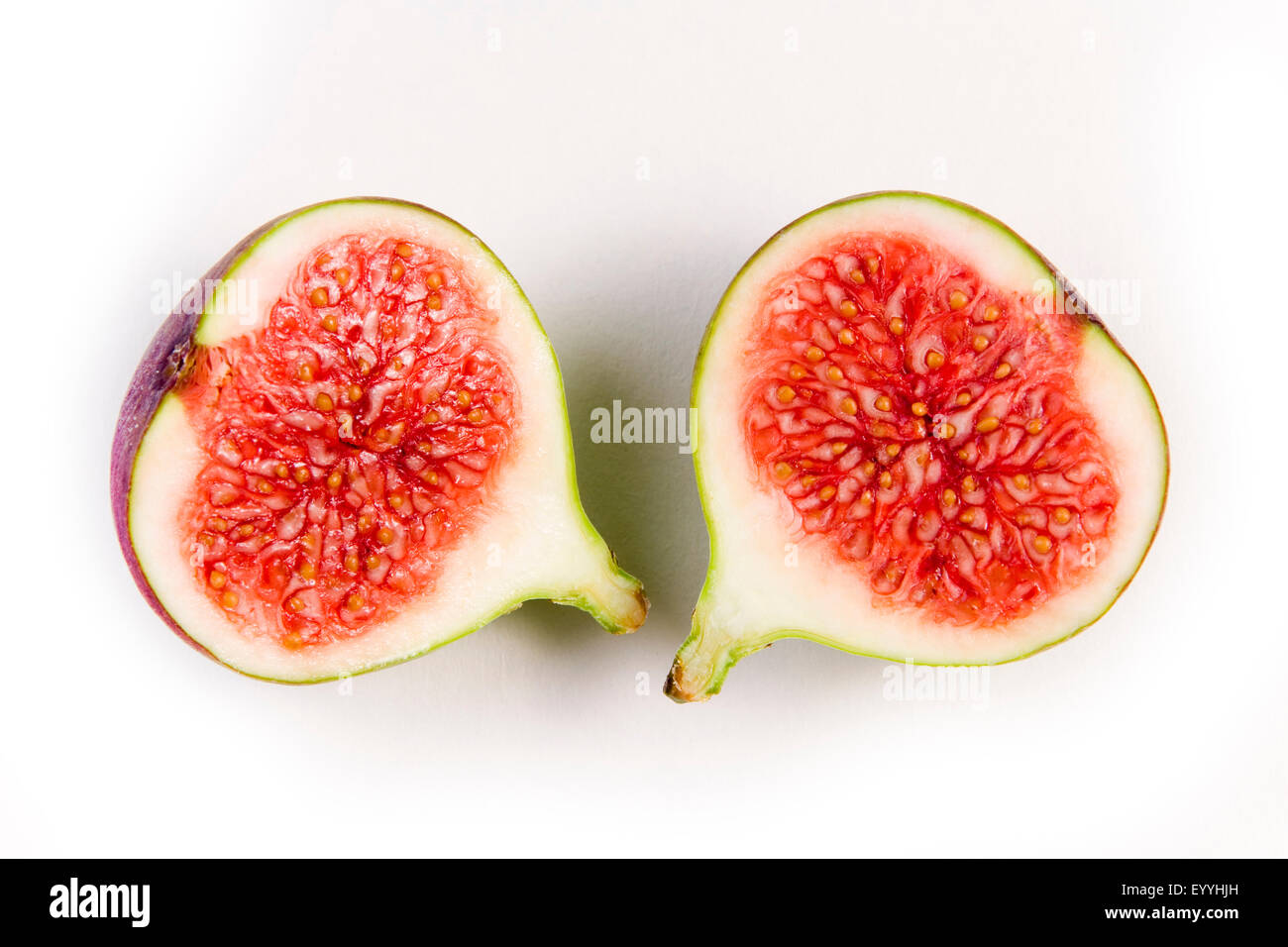 fig (Ficus carica), halved fig, cut-out Stock Photo