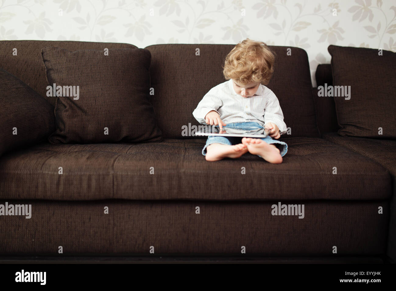 Little boy using tablet computer, indoor Stock Photo - Alamy