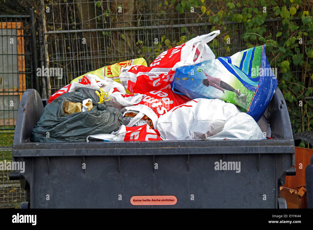 crowded garbage container, Germany Stock Photo