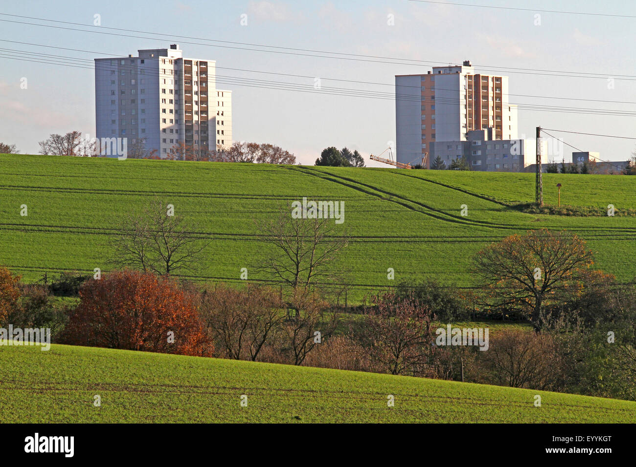 tower blocks and hilly field landscape in autumn, Germany, North Rhine-Westphalia Stock Photo