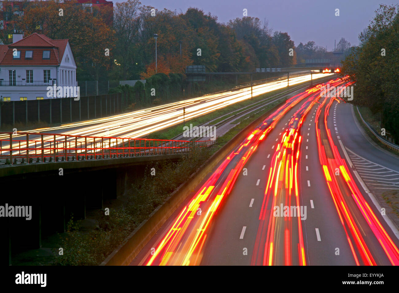 dense traffic, light streaks on motorway A40 in the evening, Germany, North Rhine-Westphalia Stock Photo