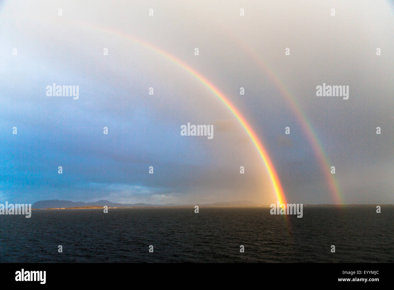 double rainbow at the coast, Norway, Soer-Troendelag, Trondheim, Lyngholmrasa Stock Photo
