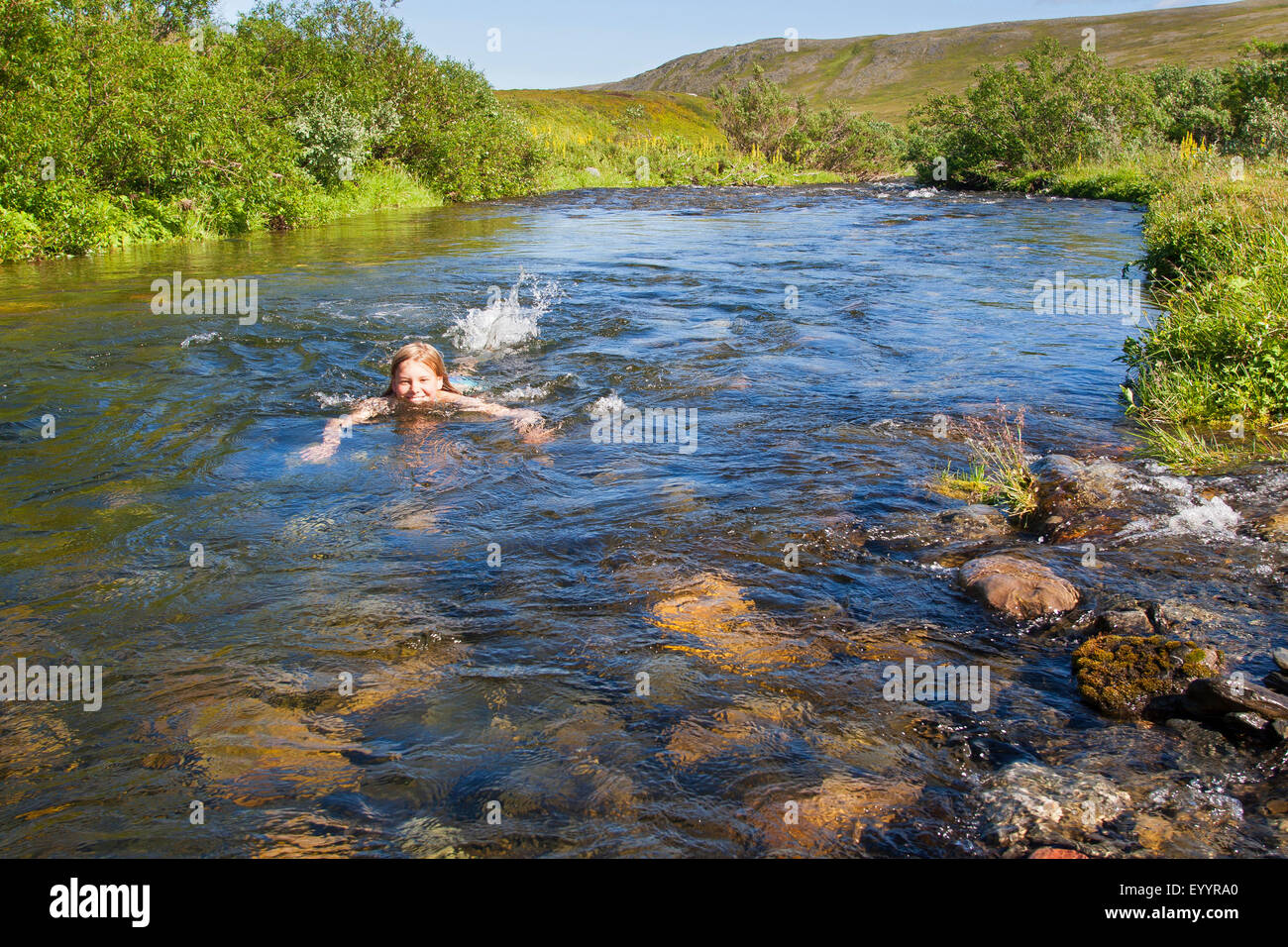 girl bathing in a creek, Germany Stock Photo