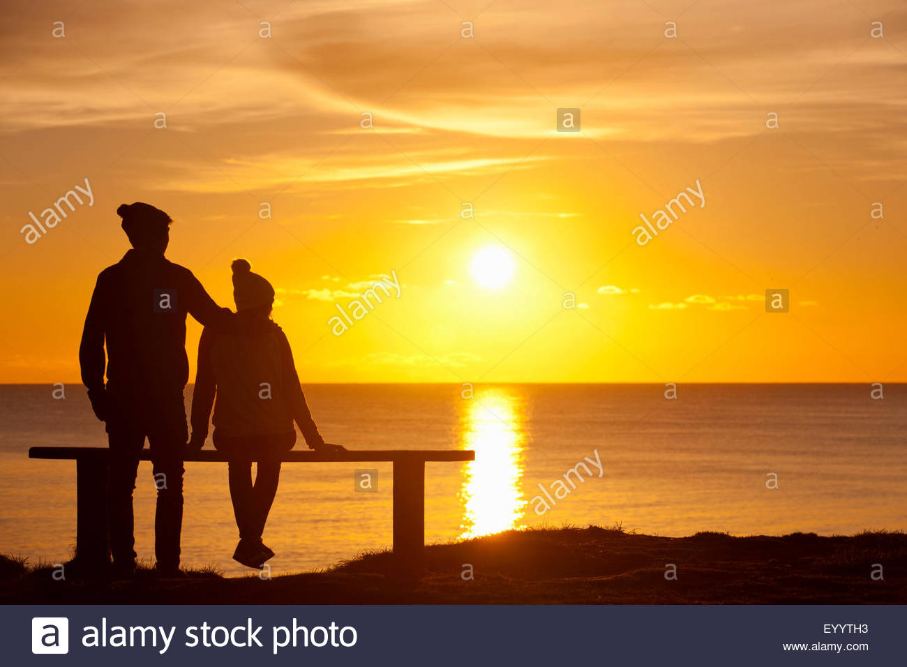 Silhouette Couple Sitting On Bench Stock Photos & Silhouette Couple ...