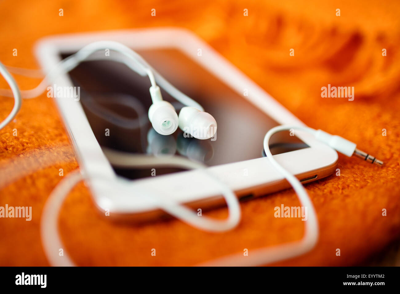 White earphones and tablet pc, close up photo, small dof Stock Photo