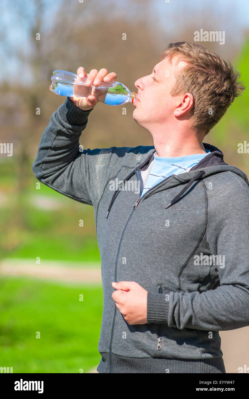 a young man with a bottle of water Stock Photo - Alamy