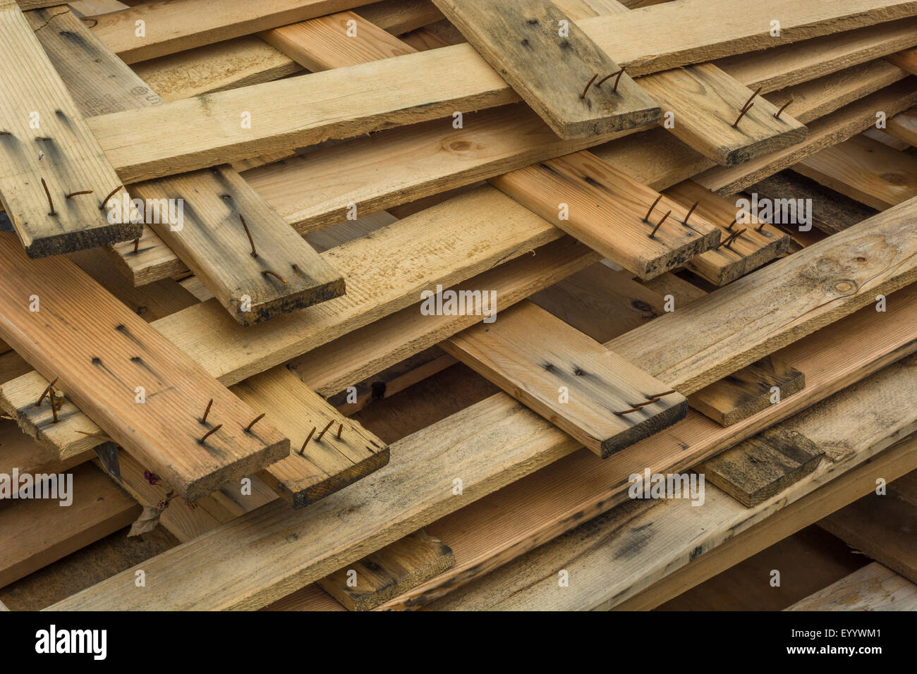 Broken wooden pallets on an industrial site. Stock Photo