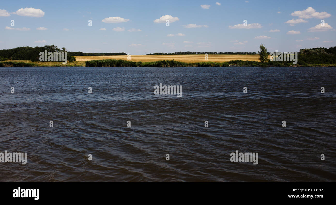 Summer landscape with river and cloudy sky Stock Photo - Alamy