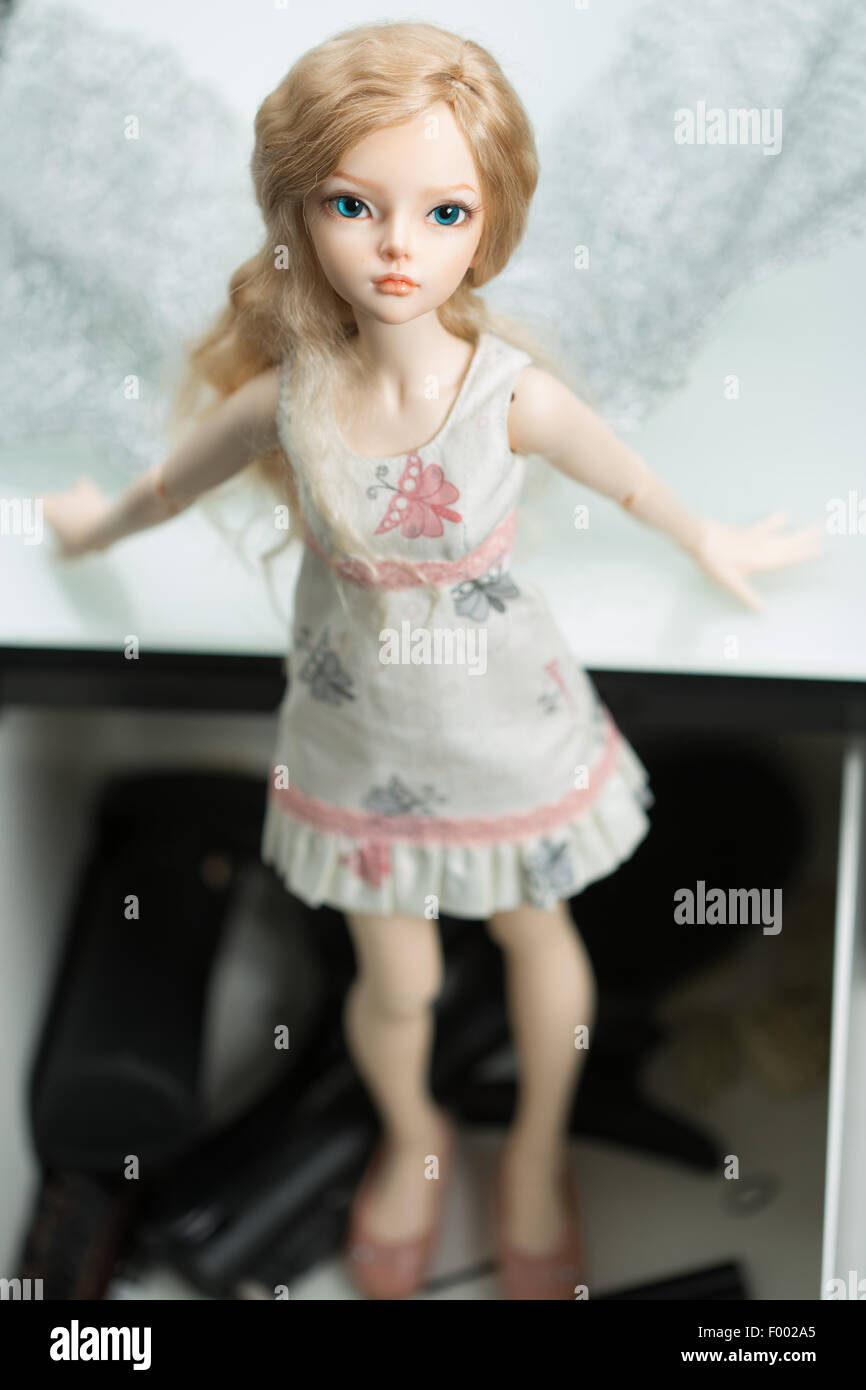 doll in a box on a light background. blurred rear plan Stock Photo Alamy