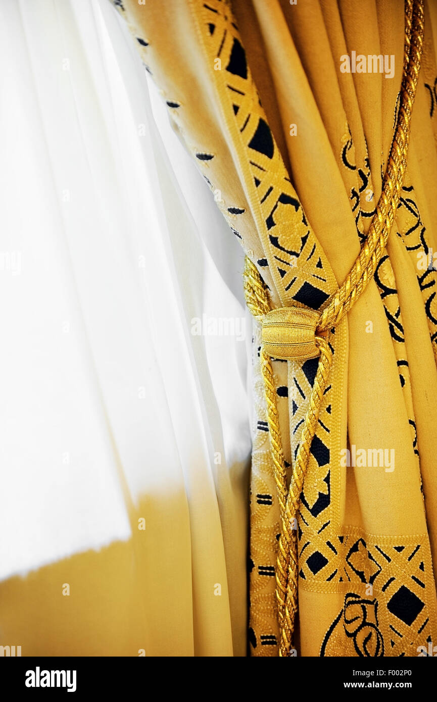 Luxury Yellow Window Curtain With Decorative Tassel Stock Photo