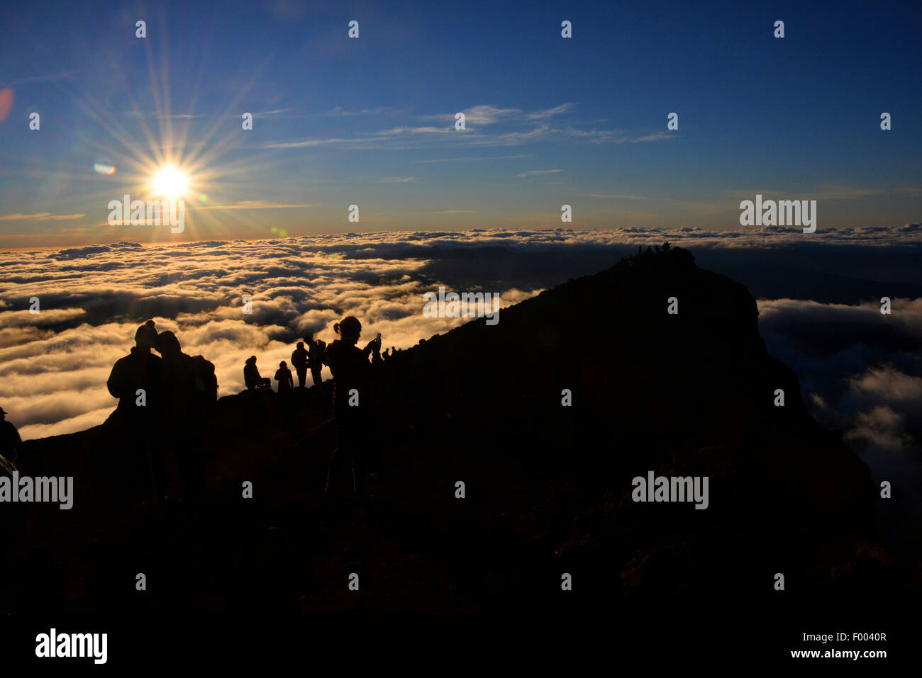 view from mountain summit of volcano Piton des Neiges at sunrise