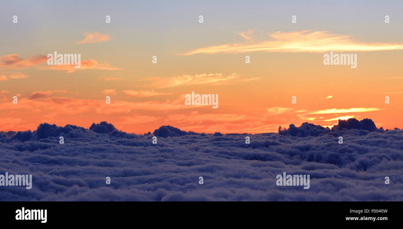 view from mountain summit of volcano  Piton des Neiges at sunrise, Reunion Stock Photo