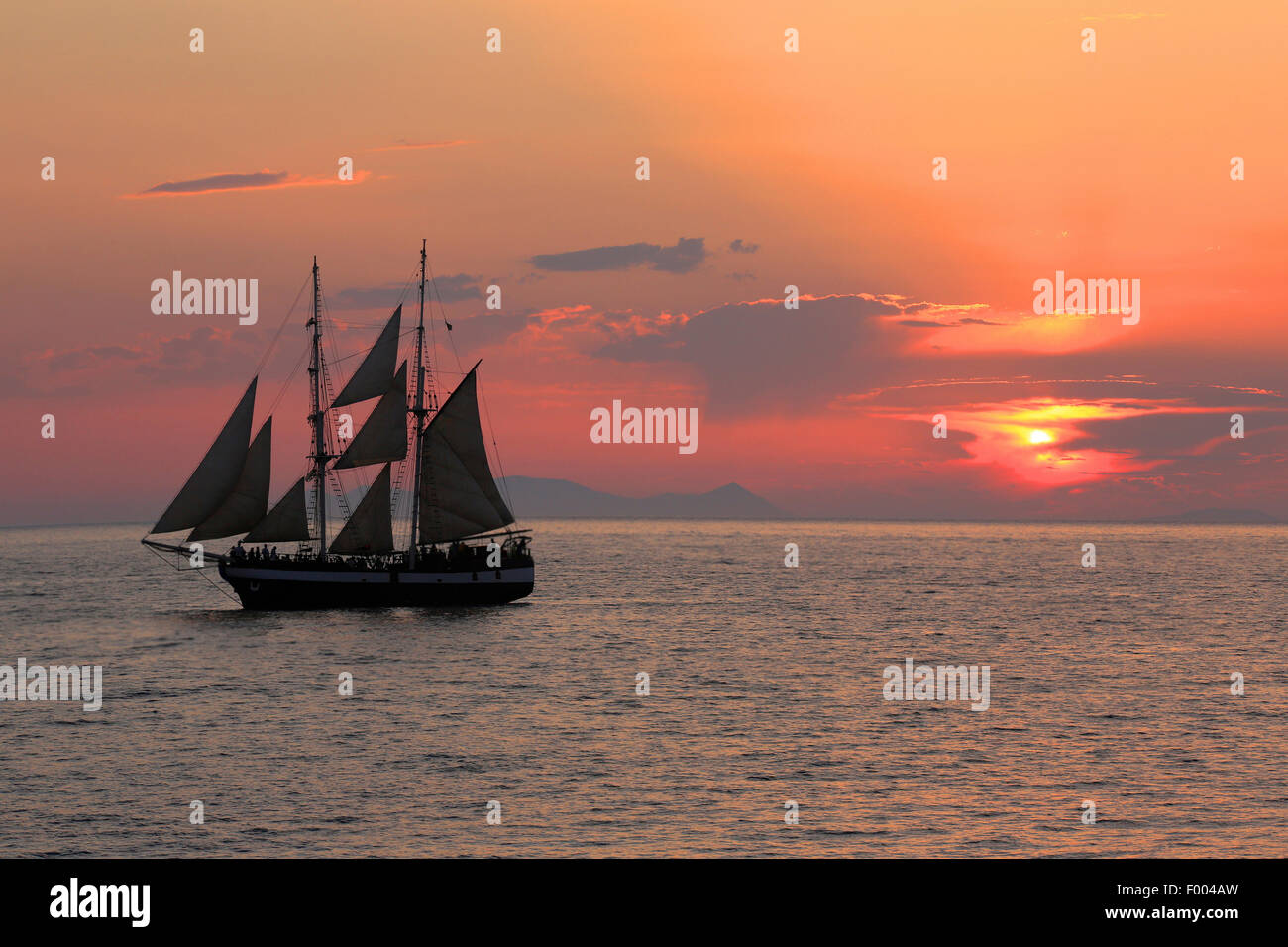 sailing ship at sunset, Greece, Cyclades, Santorin Stock Photo