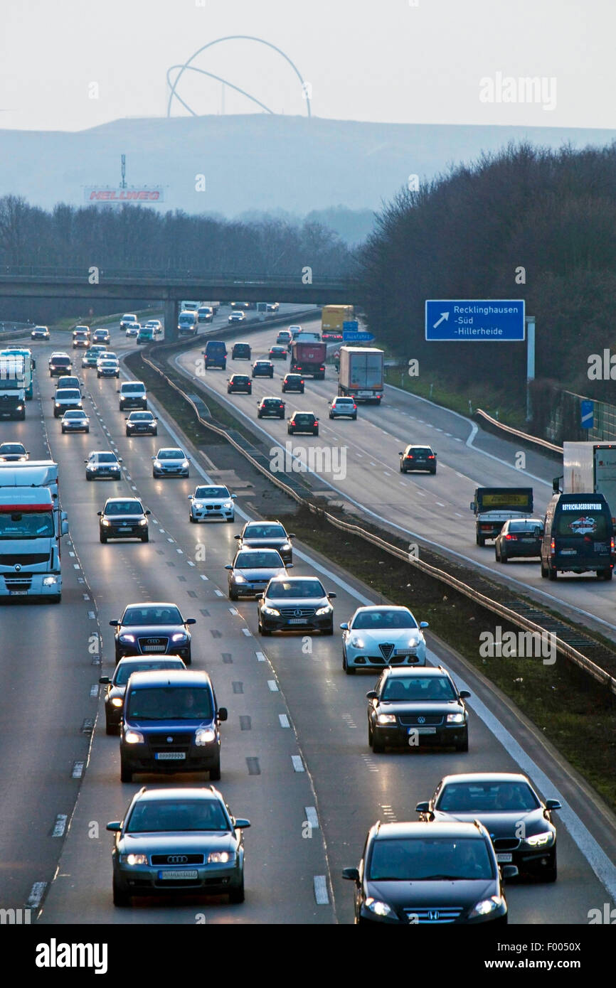traffic on motorway A2 in evening light, Horizon Observatory on top of slagheap Hoheward in background, Germany, North Rhine-Westphalia, Ruhr Area, Recklinghausen Stock Photo