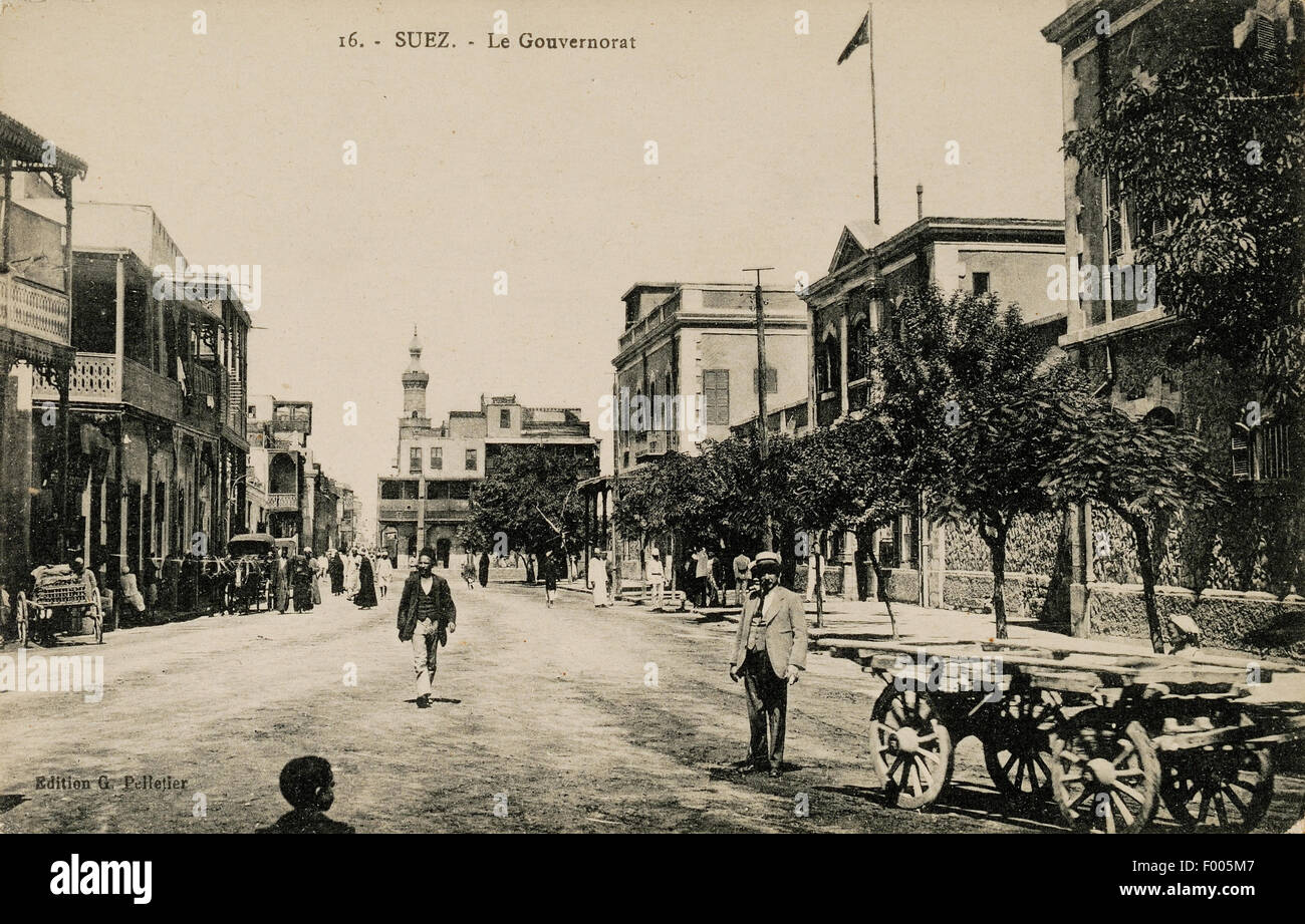 Suez, Egypt - 1900 - An old postcard of a bustling street in Suez, the city at the southern end of the Suez Canal. COPYRIGHT PHOTOGRAPHIC COLLECTION OF BARRY IVERSON ALL RIGHTS RESERVED Stock Photo