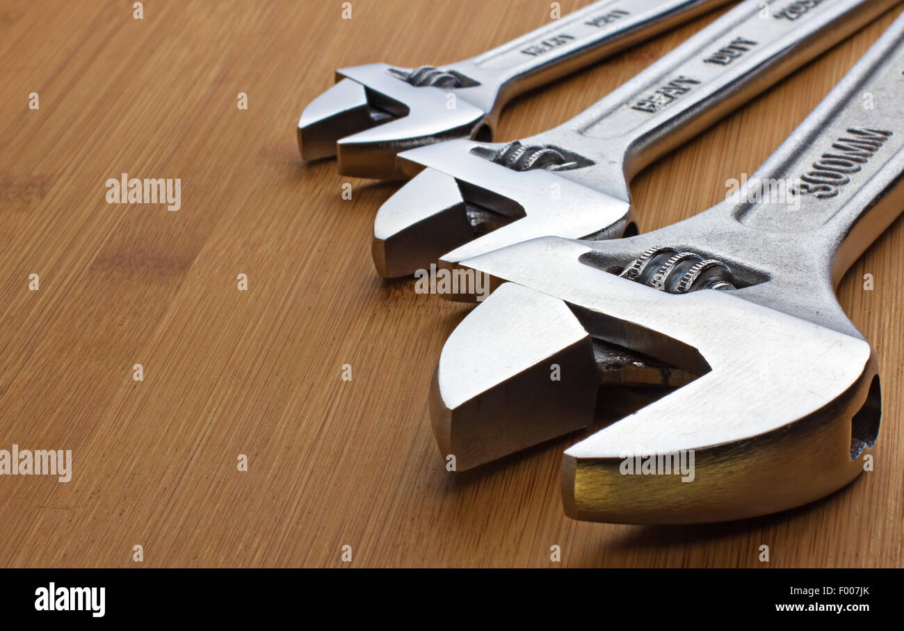 the silver wrenches lying on the table Stock Photo