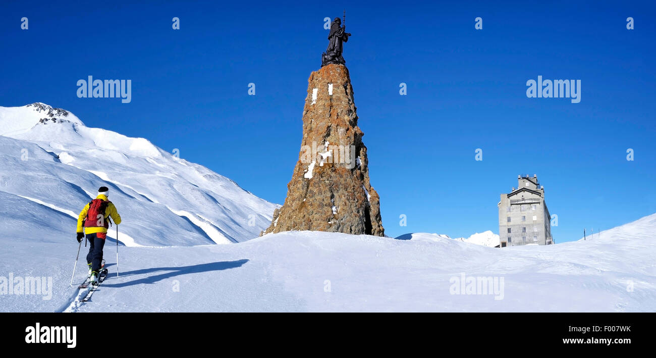 skiing in front of ancient hospice at Little St Bernard Pass, France, Savoie Stock Photo
