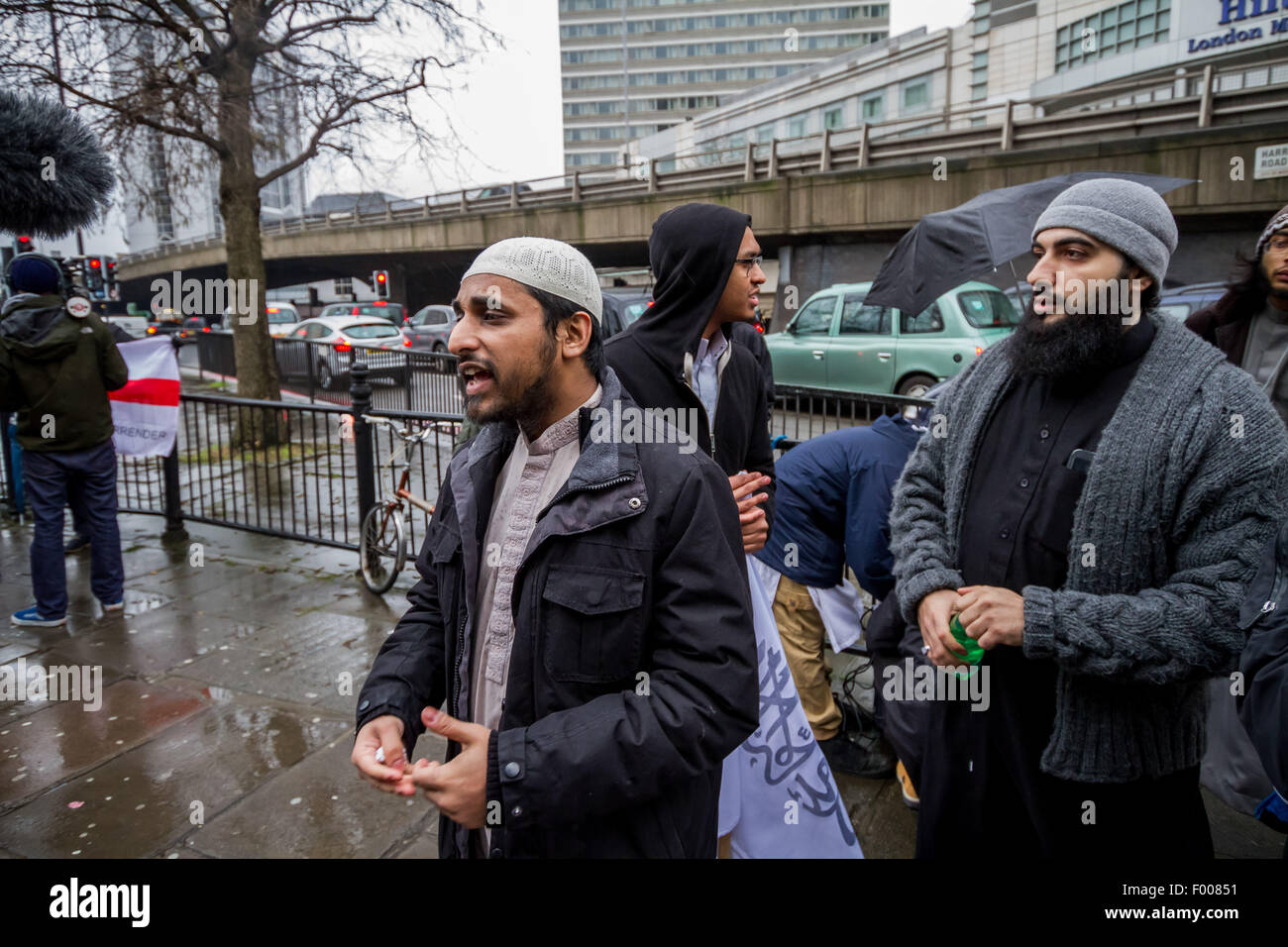 London, UK. 5th August, 2015. File Images: Radical Islamist Mohammed Mizanur Rahman (pictured here centre left giving interview) charged with encouraging support for Islamic State (ISIS). It is alleged Rahman publicised support for Islamic State through lectures published online. Credit:  Guy Corbishley/Alamy Live News Stock Photo