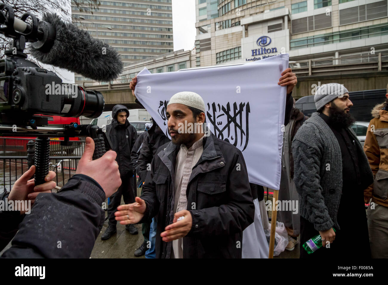 London, UK. 5th August, 2015. File Images: Radical Islamist Mohammed Mizanur Rahman (pictured here centre giving interview) charged with encouraging support for Islamic State (ISIS). It is alleged Rahman publicised support for Islamic State through lectures published online. Credit:  Guy Corbishley/Alamy Live News Stock Photo