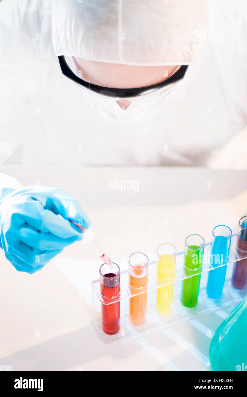 Several Samples in Test Tubes and Pipette in Hand Stock Photo