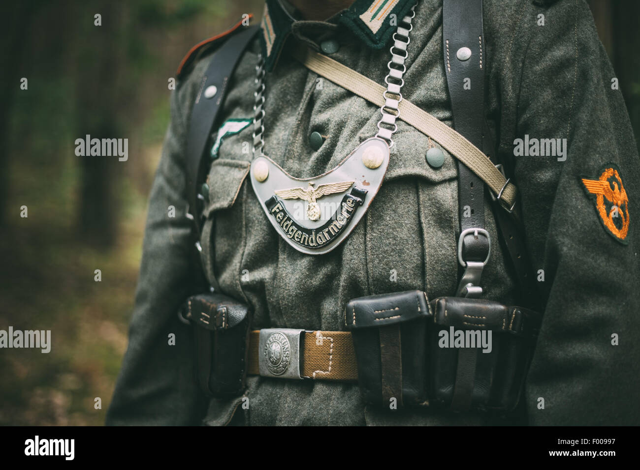 Unidentified re-enactor dressed as German soldier. German military decoration on the uniform of a German soldier. Stock Photo