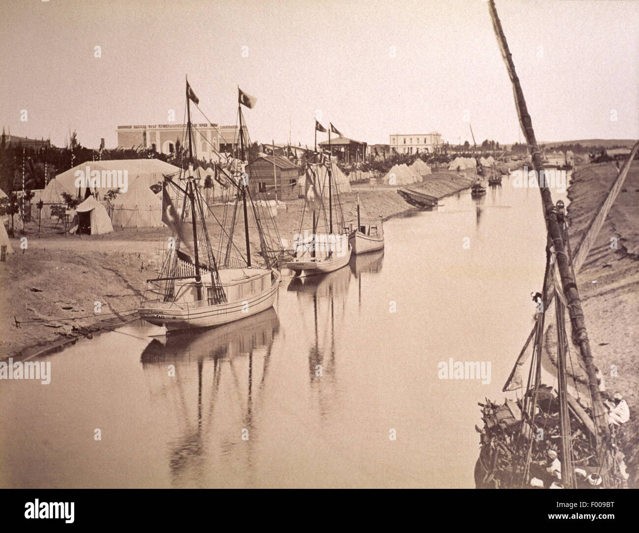 Ismailia, Egypt-1880s-A feeder canal to the Suez Canal in Ismailia.  Ismailia was established in 1863 to serve as a base camp for the construction of the Suez Canal.   photograph by Arnoux Stock Photo