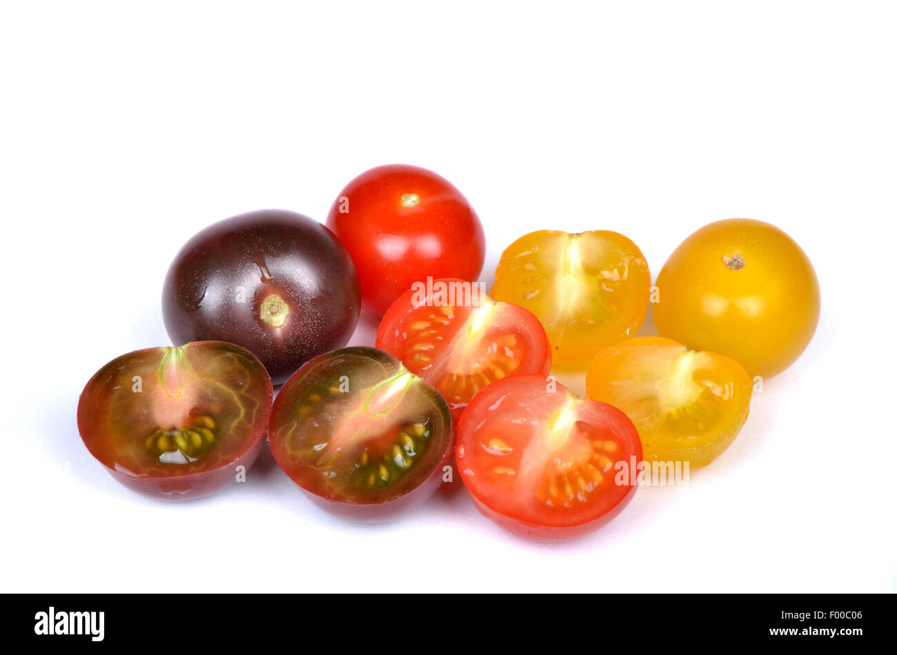 garden tomato (Solanum lycopersicum, Lycopersicon esculentum), cherry tomatoes in yellow, red and black Stock Photo
