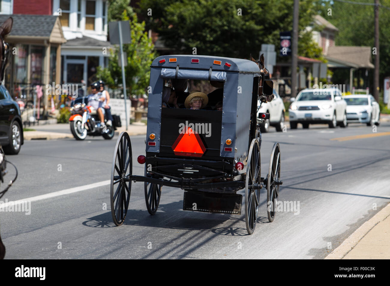 Amish buggies share the roadway in Lancaster County, PA. Stock Photo