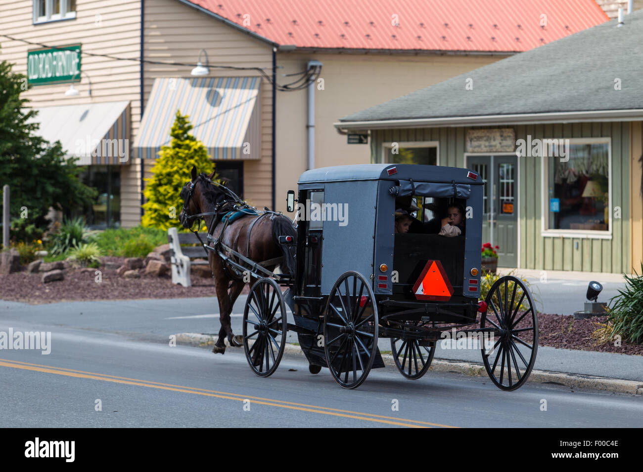 Amish buggies share the roadway in Lancaster County, PA. Stock Photo