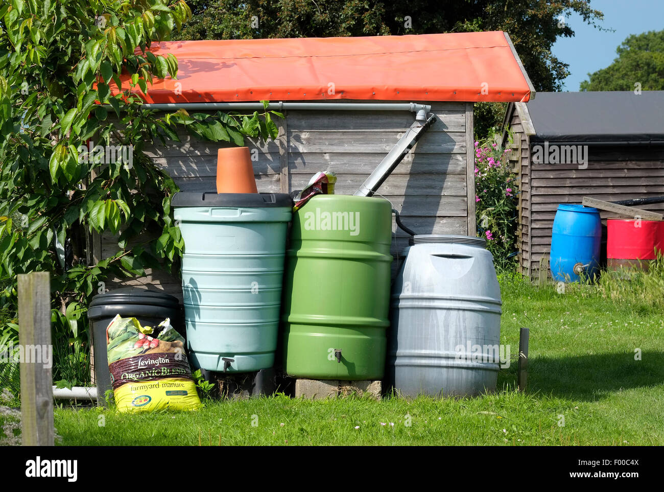 collecting rain water in plastic containers Stock Photo Alamy