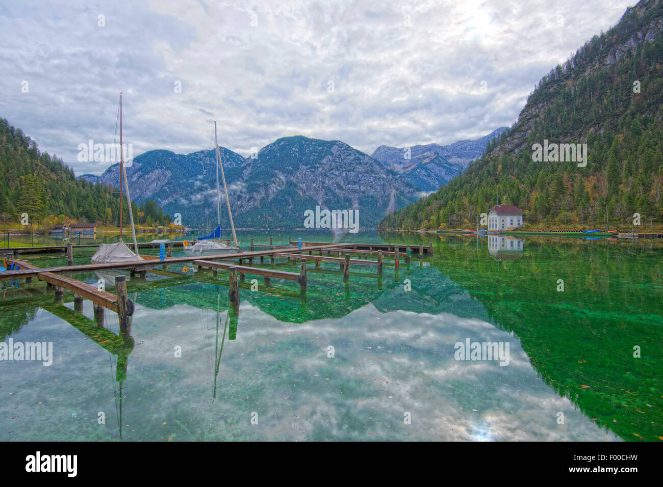 boat bridge on a clear lake in autumn, Plansee, Austria, Tyrol Stock Photo