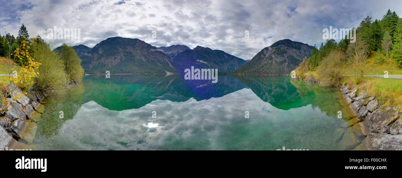 autumnal mountain scenery mirroring in lake Plansee, Austria, Tyrol Stock Photo