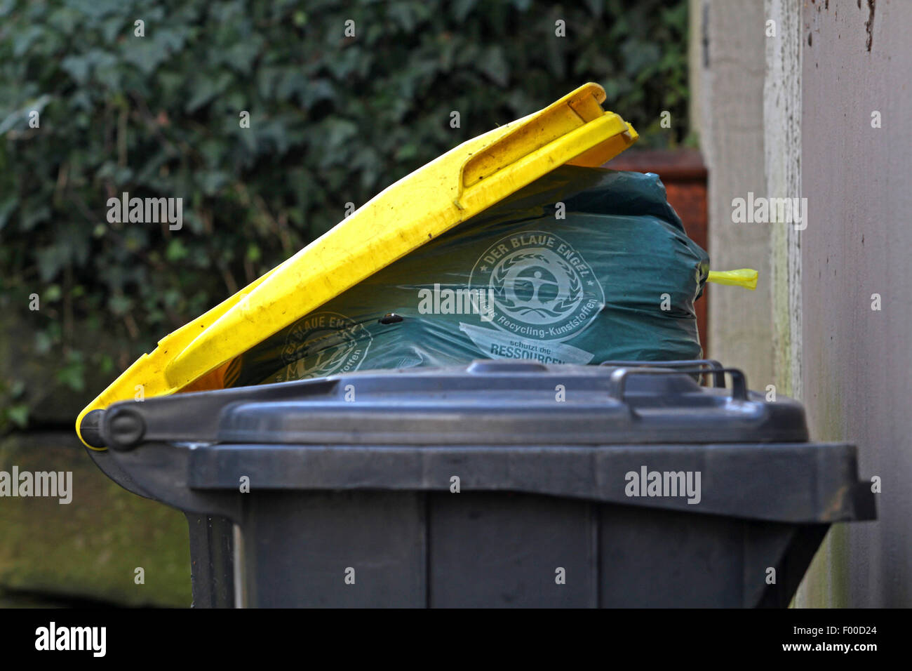 overfilled yellow bin on the roadside, Germany Stock Photo Alamy