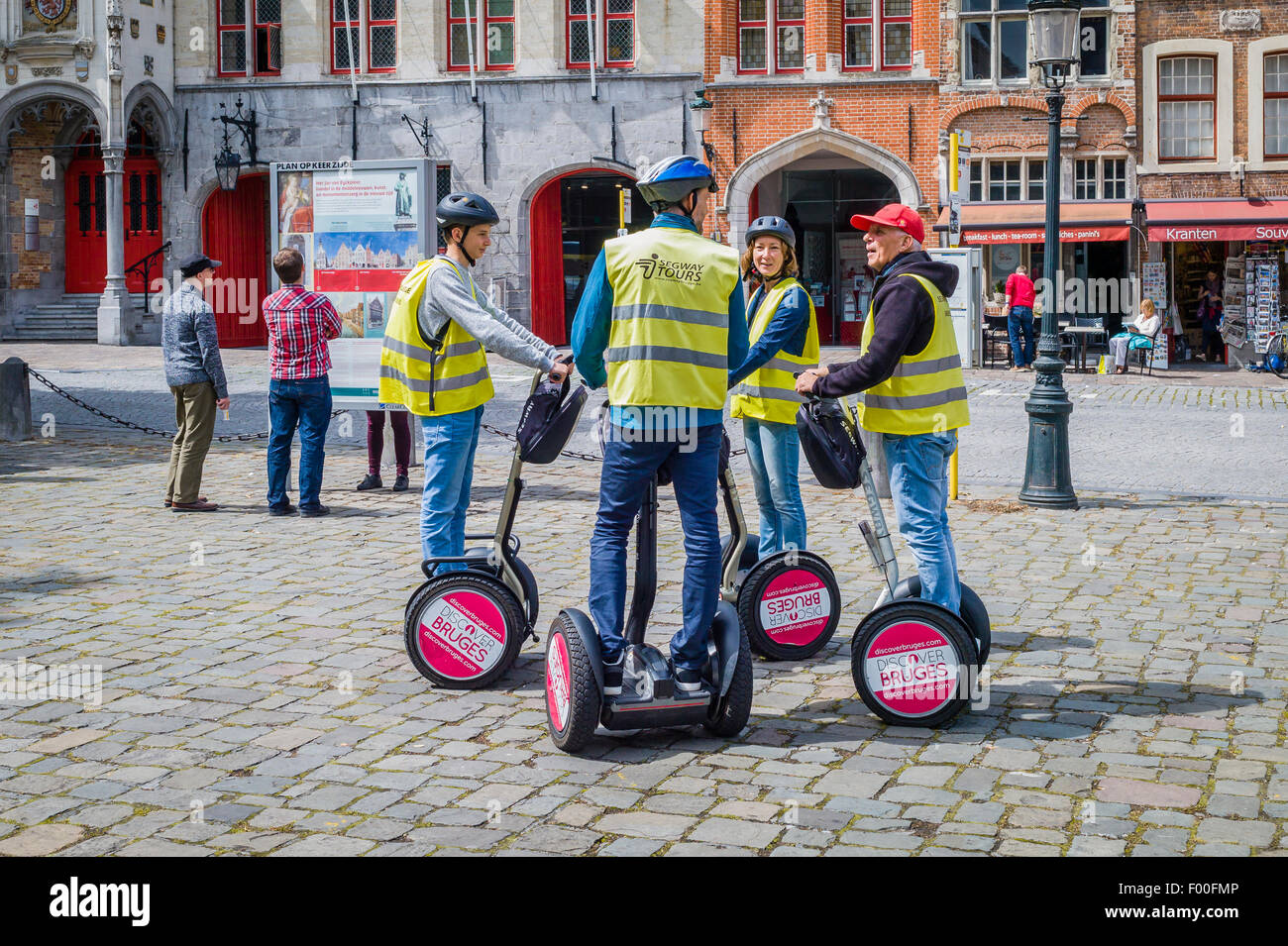 A group of people using 'Segway' two wheeled transport to take a tourist trip around Brugge, Belgium. Stock Photo