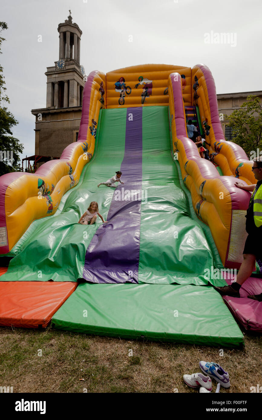 Inflatable Slide in St Matthews Church Gardens at Brixton Splash 2015 Stock Photo