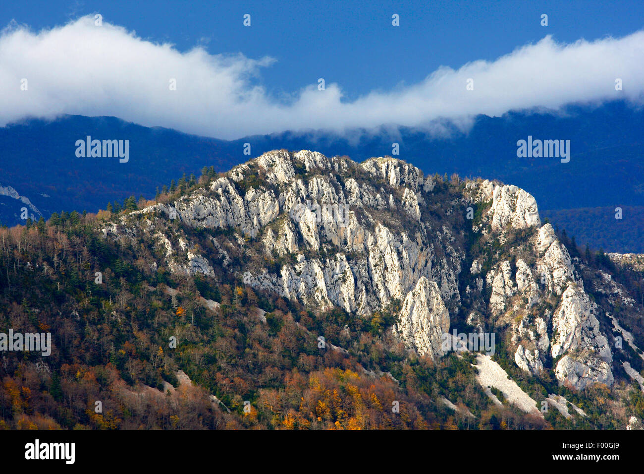 mountain peaks and rocks in mist in autumn, France, Vercors National Park Stock Photo