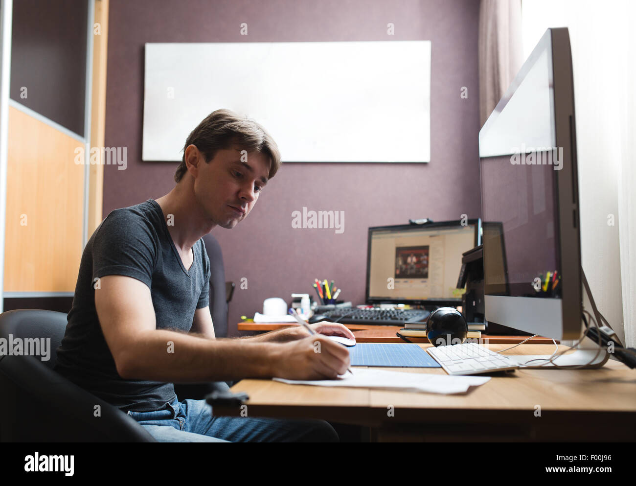 Freelance developer or designer working at home Stock Photo
