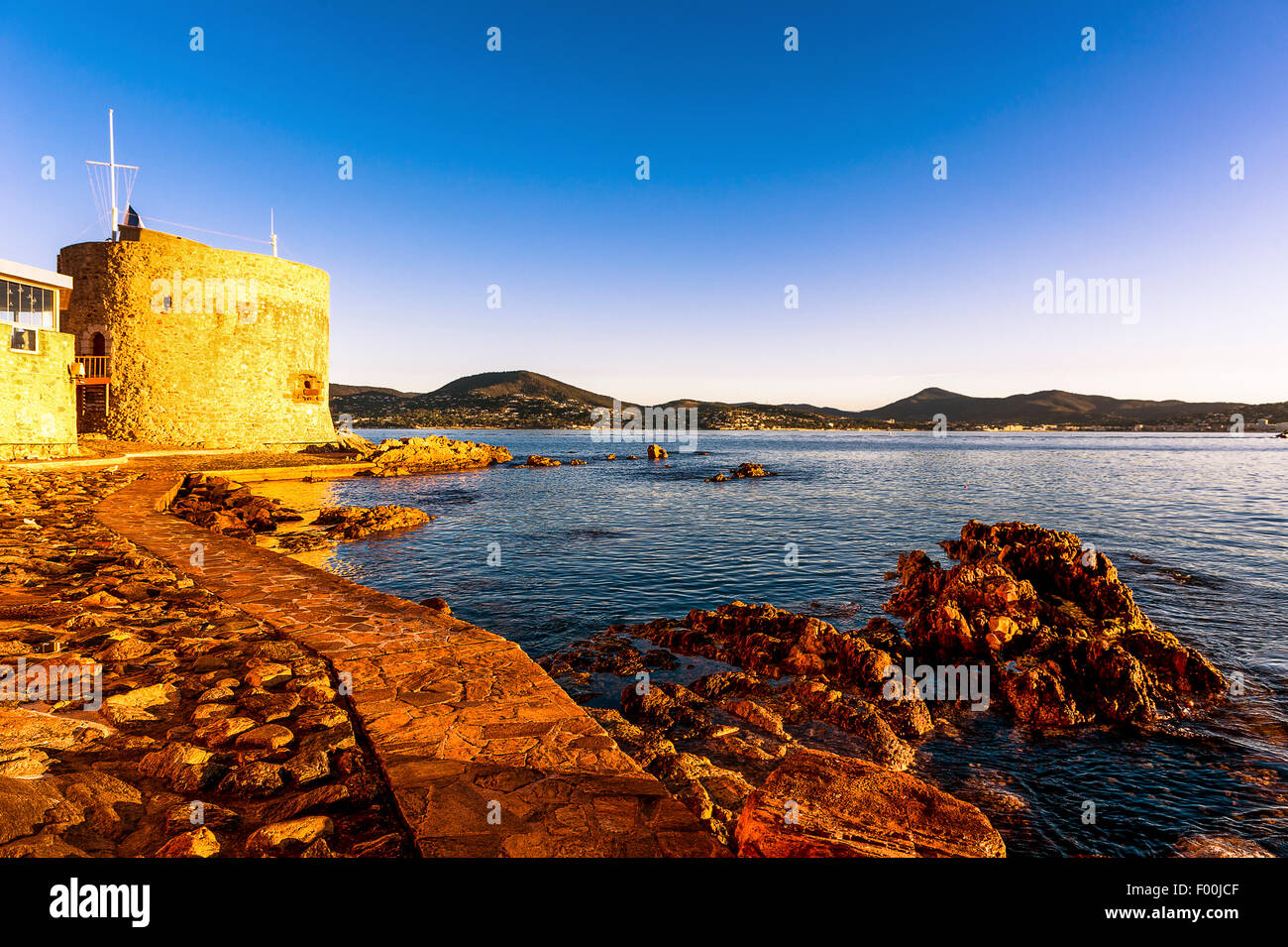 Europe, France, Var, Saint-Tropez. Ponche beach and the Tower Portalet at the early morning, XV century. Stock Photo